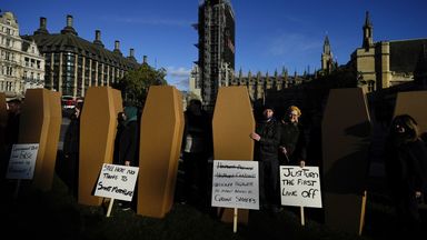 Protesters carry 38 38 cardboard coffins,  one for each life lost on smart motorways between 2014 and 2019.